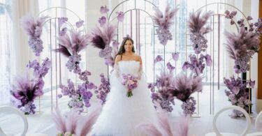 wedding ceremony with purple flowers